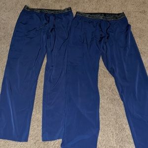 Two pair image, navy blue scrub pants, both size medium